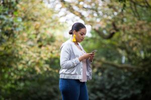 African American female checking her mobile phone